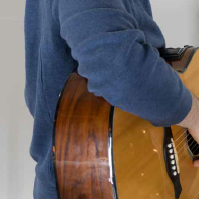 sit up straight to play guitar properly