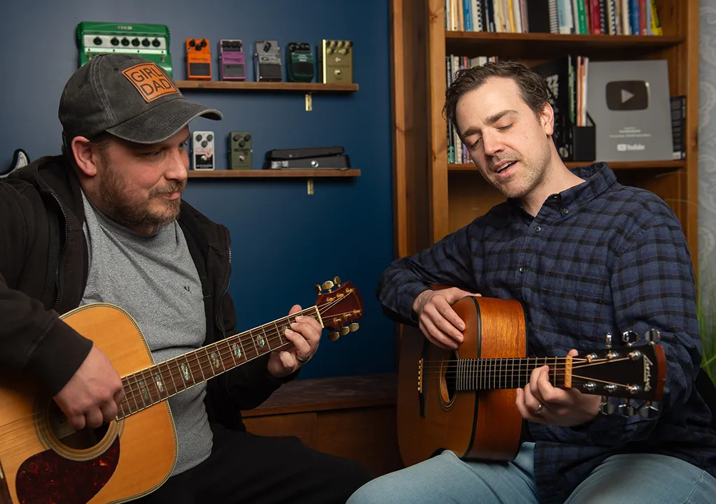 Teaching my student eric how to play the blues on acoustic guitar