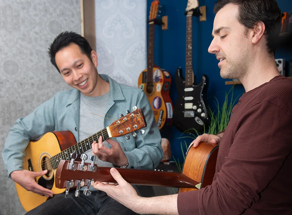 Giving Trevor a fingerstyle guitar lesson