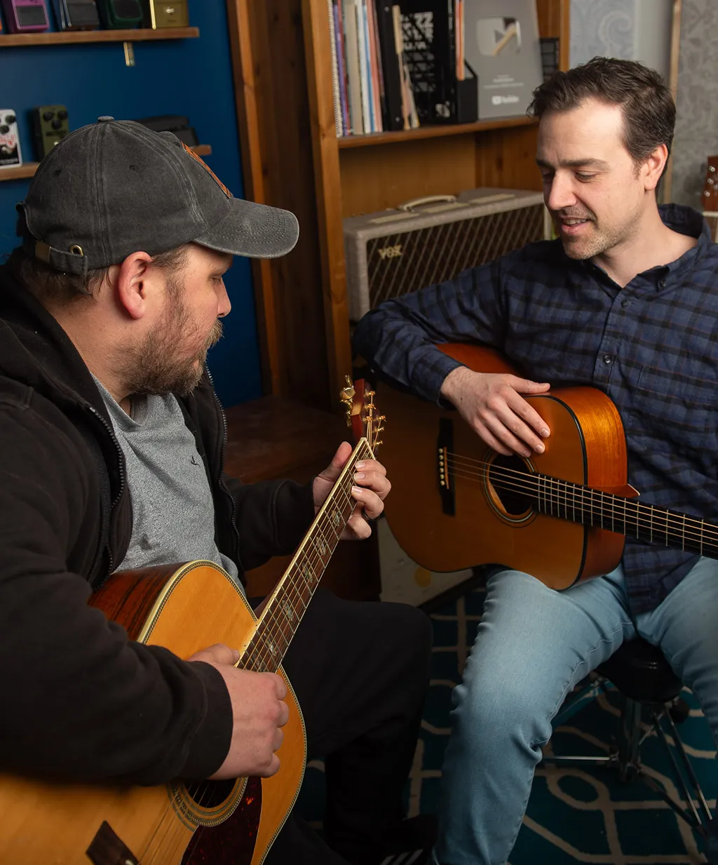 Giving Eric a fingerpicking guitar lesson