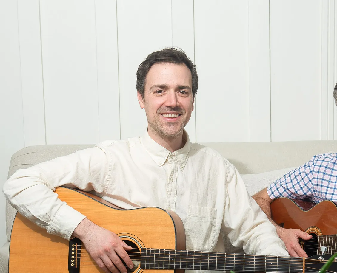 James in his studio - teaching guitar to Chris