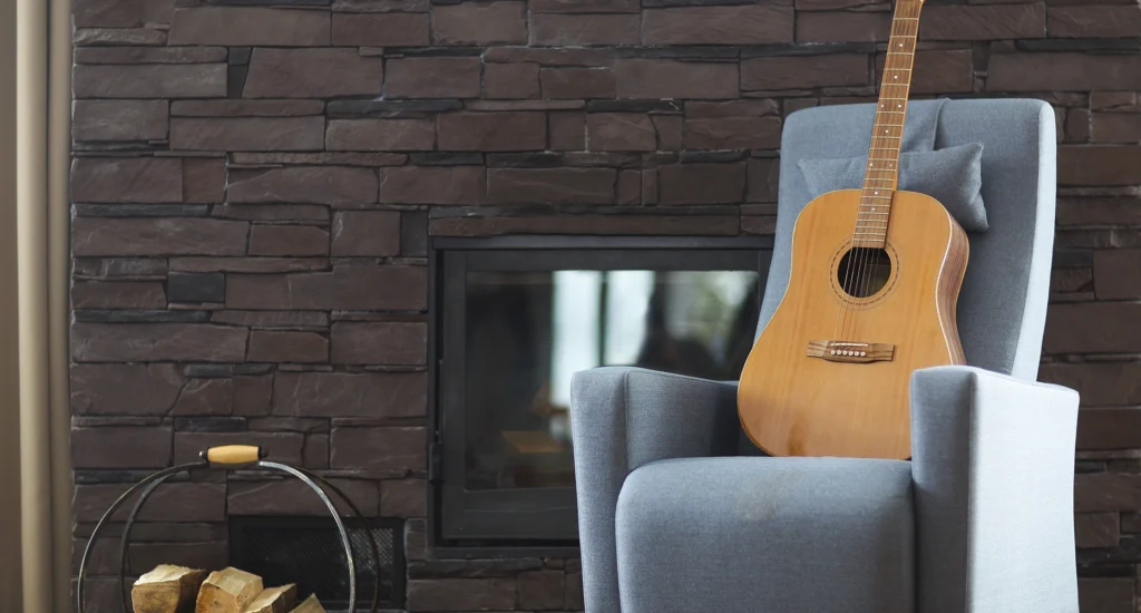 close-up-guitar-sofa-against-wall-home